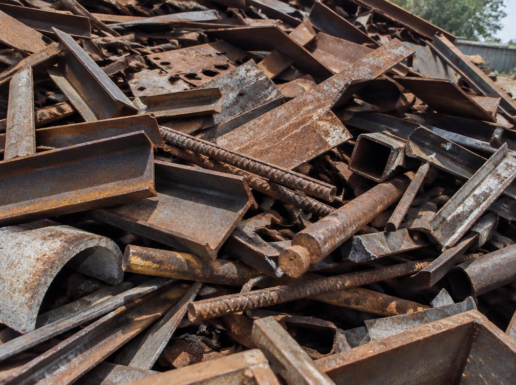 Pile of mixed iron scrap pieces in a yard